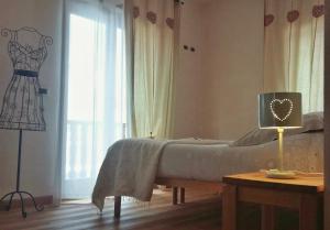 Postel nebo postele na pokoji v ubytování Maison Le Champ B&B Questa casa non è un albergo