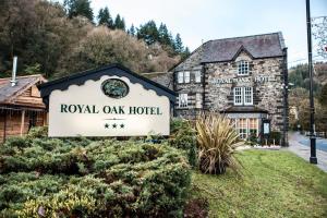 a hotel sign in front of a building at Royal Oak Hotel in Betws-y-coed