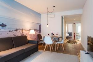a living room with a couch and a table at ALTIDO Elegant Liberdade Apartments in Lisbon