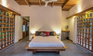 Un pat sau paturi într-o cameră la La Paz del Caribe
