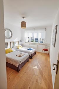 En eller flere senge i et værelse på Les Appartements Saint-Michel - centre-ville 2 chambres 90m2 avec garage