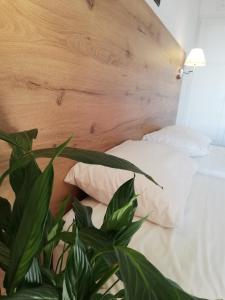 A bed or beds in a room at The Mathraki Studios