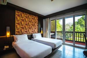 Gallery image of Ratana Hotel Chalong in Rawai Beach