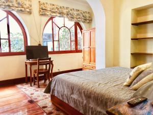 Postel nebo postele na pokoji v ubytování Boutique Hotel Casa Foch