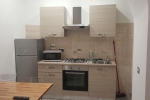 Kuchyň nebo kuchyňský kout v ubytování Appartamento Martino + 8 fotografií