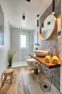 a bathroom with a sink and a mirror at rose in Fažana