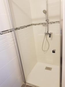 a shower with a glass door in a bathroom at BAIE DE SOMME - Le pourquoi pas in Le Crotoy