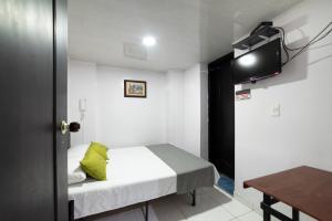 Un pat sau paturi într-o cameră la Ayenda 1016 Bogota Chapinero