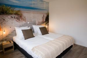 Кровать или кровати в номере De Nagtegaal