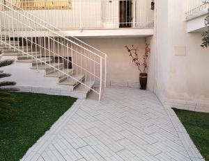 a stairway leading up to a building with a staircase at Civico 13 in Camposano