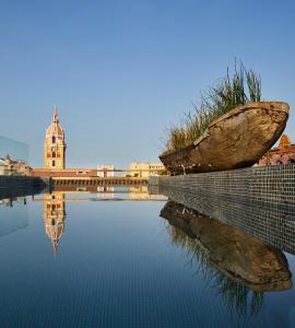 a large rock sitting on the side of a body of water at Hotel Boutique Casona del Colegio in Cartagena de Indias