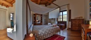 Casa Balata Farm House tesisinde bir odada yatak veya yataklar