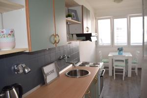 a kitchen with a sink and a counter top at Apartment Optimist/Downtown in Split