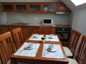 Kuchyň nebo kuchyňský kout v ubytování Apartmány Prima Nova Lake