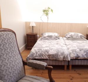 Postel nebo postele na pokoji v ubytování La Renardière