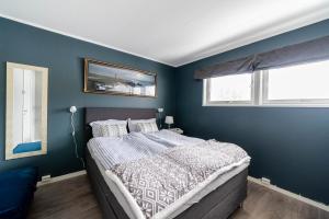 Een bed of bedden in een kamer bij Reinebringen Apartments