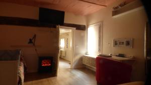 a living room with a room with a fire place at Badia in Modena