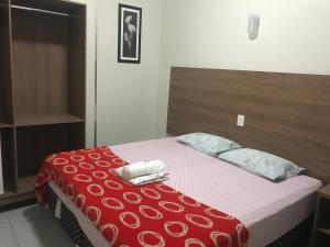 Tempat tidur dalam kamar di Hotel MM AEROPORTO BRASÍLIA