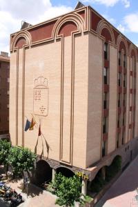 a building with a sign on the side of it at Pacoche Murcia in Murcia