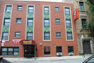 a red brick building with a sign on it at Chinatown Hotel Chicago in Chicago