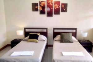A bed or beds in a room at MS Residence Building