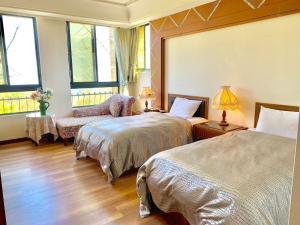Postel nebo postele na pokoji v ubytování Dream Forest Villa