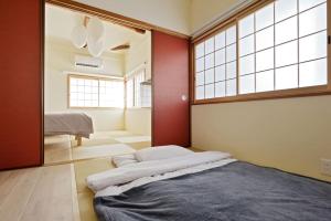 Postelja oz. postelje v sobi nastanitve Vacation House Tennoji 168, Osaka