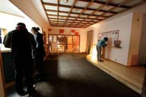 a group of people standing in a room at Alpine Villa Nozawa in Nozawa Onsen