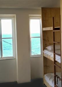 Postel nebo postele na pokoji v ubytování Mar à Vista Hostel