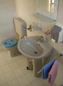 a bathroom with a sink and a toilet at Apartment below the stars in Rovinj