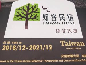 Ein Zertifikat, Auszeichnung, Logo oder anderes Dokument, das in der Unterkunft Kinmen Line In Bed and Breakfast ausgestellt ist