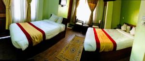 Voodi või voodid majutusasutuse Kathmandu Garden Home toas