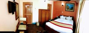 Voodi või voodid majutusasutuse Kathmandu Garden Home toas