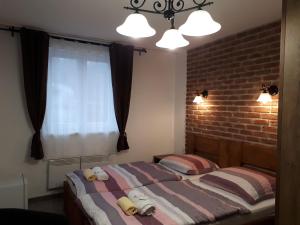 Postel nebo postele na pokoji v ubytování Penzion - Restaurant U Zámku