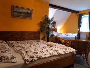 Postel nebo postele na pokoji v ubytování Penzion - Restaurant U Zámku