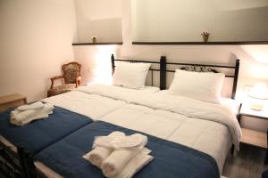 Un pat sau paturi într-o cameră la X Palace