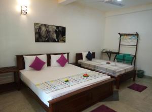 A bed or beds in a room at Ging View Villa