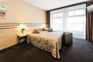 Ένα ή περισσότερα κρεβάτια σε δωμάτιο στο Hotel Wilga +32 φωτογραφίες