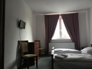 Posteľ alebo postele v izbe v ubytovaní Hotel Arko