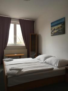 Posteľ alebo postele v izbe v ubytovaní Hotel Arko