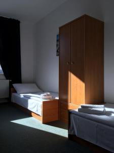 Posteľ alebo postele v izbe v ubytovaní Hotel Arko