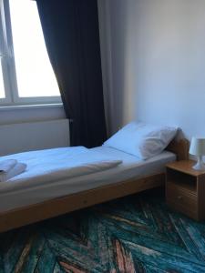 Posteľ alebo postele v izbe v ubytovaní Hotel Arko