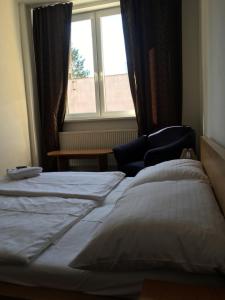 Posteľ alebo postele v izbe v ubytovaní Hotel Arko