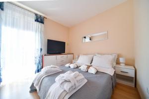 Postel nebo postele na pokoji v ubytování Deluxe Apartment Valentina