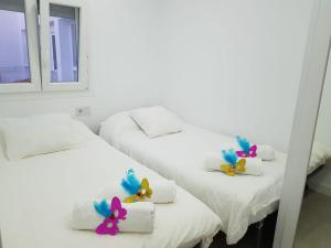 Postel nebo postele na pokoji v ubytování Caleta