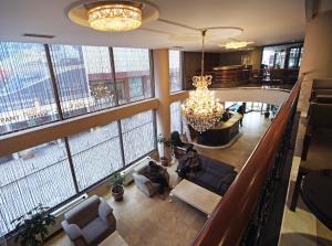 a group of people sitting in the lobby of a building at The Parma Hotel Downtown in Istanbul