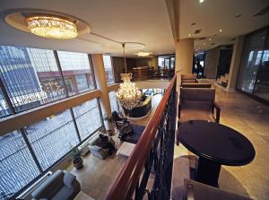 a large lobby with a view of a building at The Parma Hotel Downtown in Istanbul