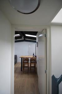 a dining room with a table and chairs in a room at studio Vincent van Gogh in Amsterdam