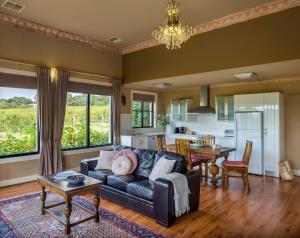a living room with a couch and a table at Barossa Shiraz Estate in Lyndoch