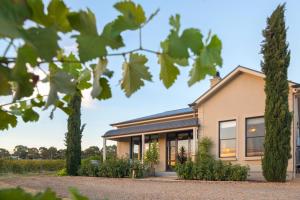a house with a porch and a large window at Barossa Shiraz Estate in Lyndoch